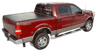 Ford Pickup Truck with accessories including step bars, grille guard, tonneau cover, bed liner, graphics and seat covers.
