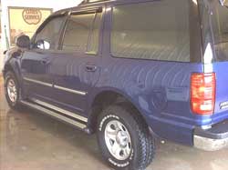 Suburban with running boards by the Pickup Guy